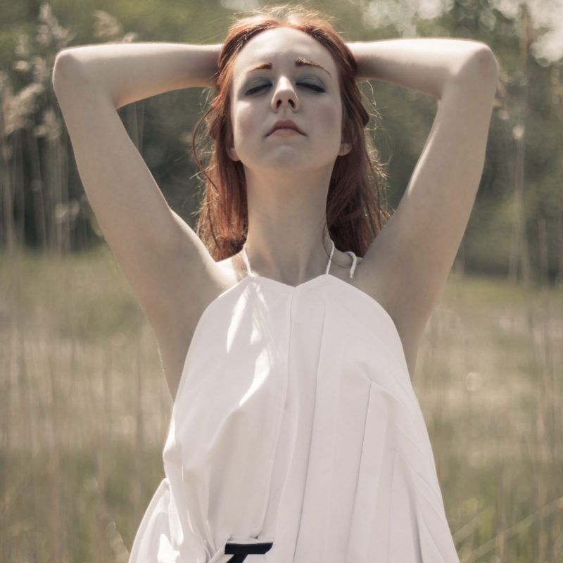 Woman wearing white organic top