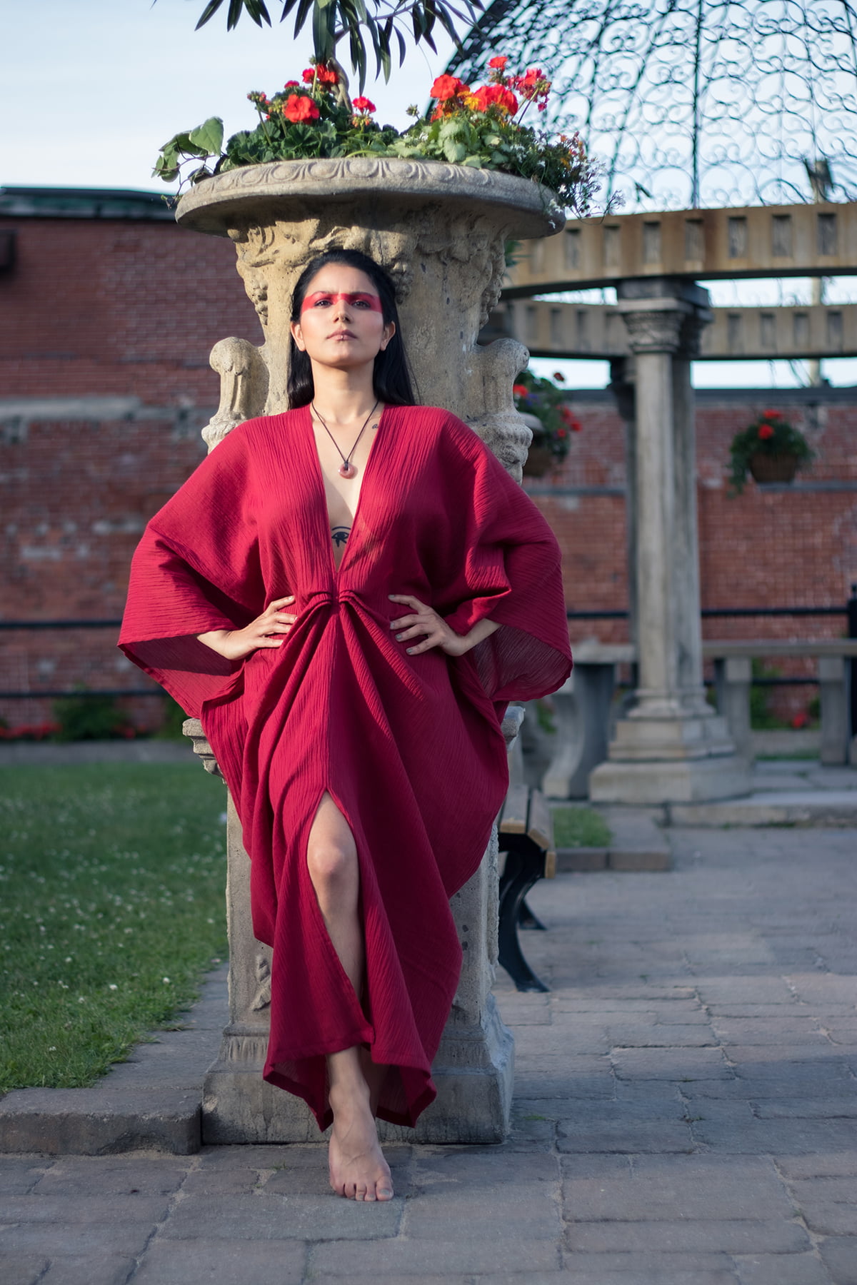 Woman wearing red organic cotton goddess red dress