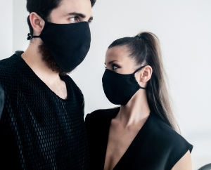 Man and woman waring organic black face masks