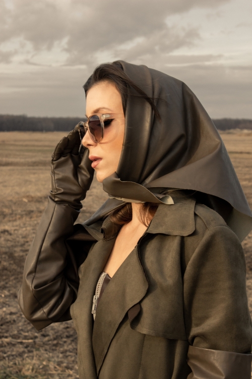 Woman wearing faux leather babushka head scarf in cedar brown