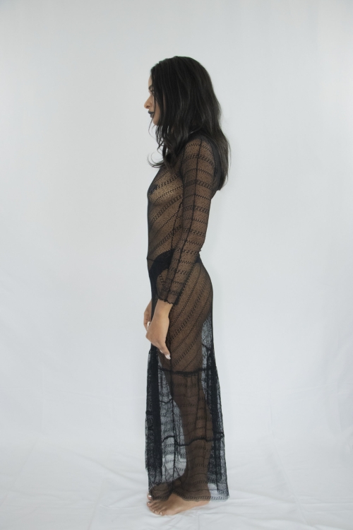Woman wearing transparent long strech laced tiered dress