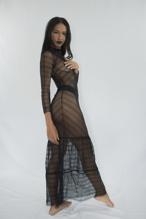 Woman wearing transparent long strech laced tiered dress