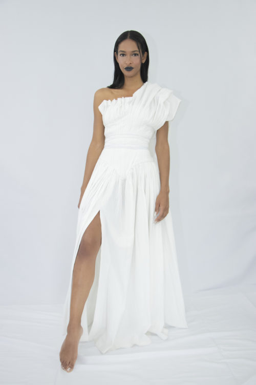 Woman wearing white organic cotton pleated wedding dress