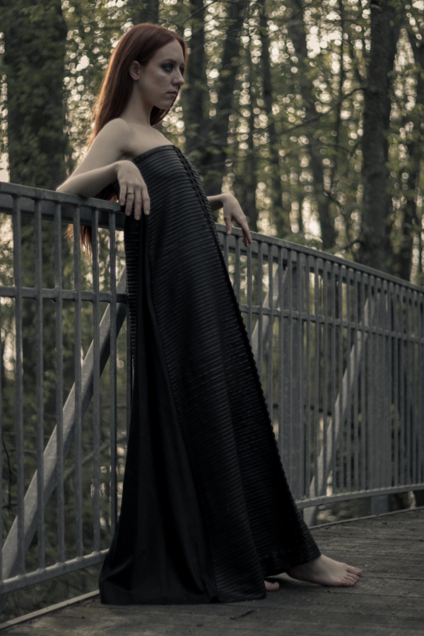 Woman wearing long black a-line dress