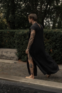 Man wearing long black dress